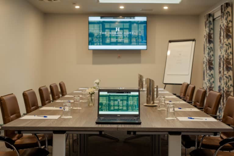 Laptop and flat screen on Hoban Hotel website in meeting room in the Hoban Hotel Kilkenny