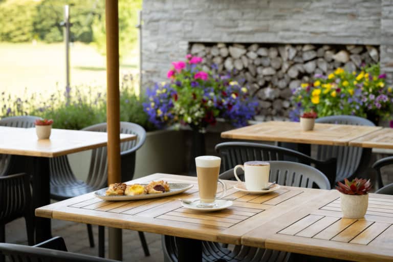 The Hoban Hotel Outdoor Area with coffee and pastries on table