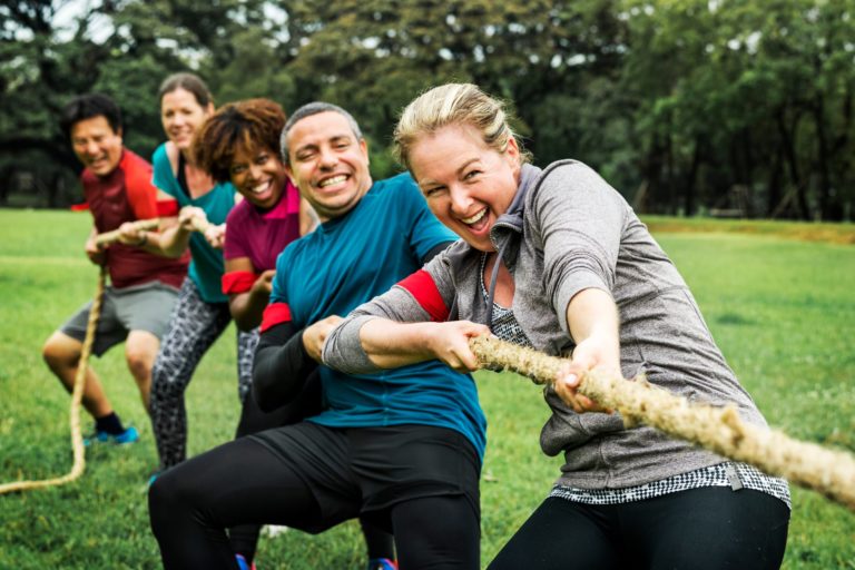 Team competing in tug of war game