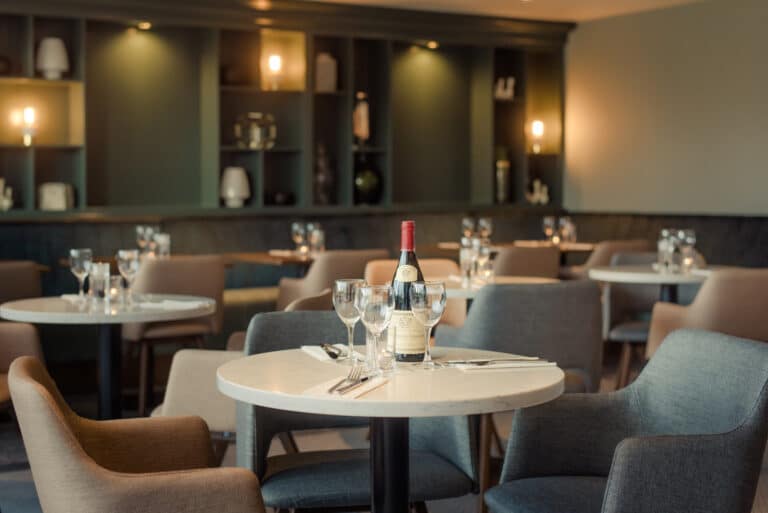 The Hoban Hotel Kilkenny 1801 Bar & Restaurant set up for dinner with bottle of red wine
